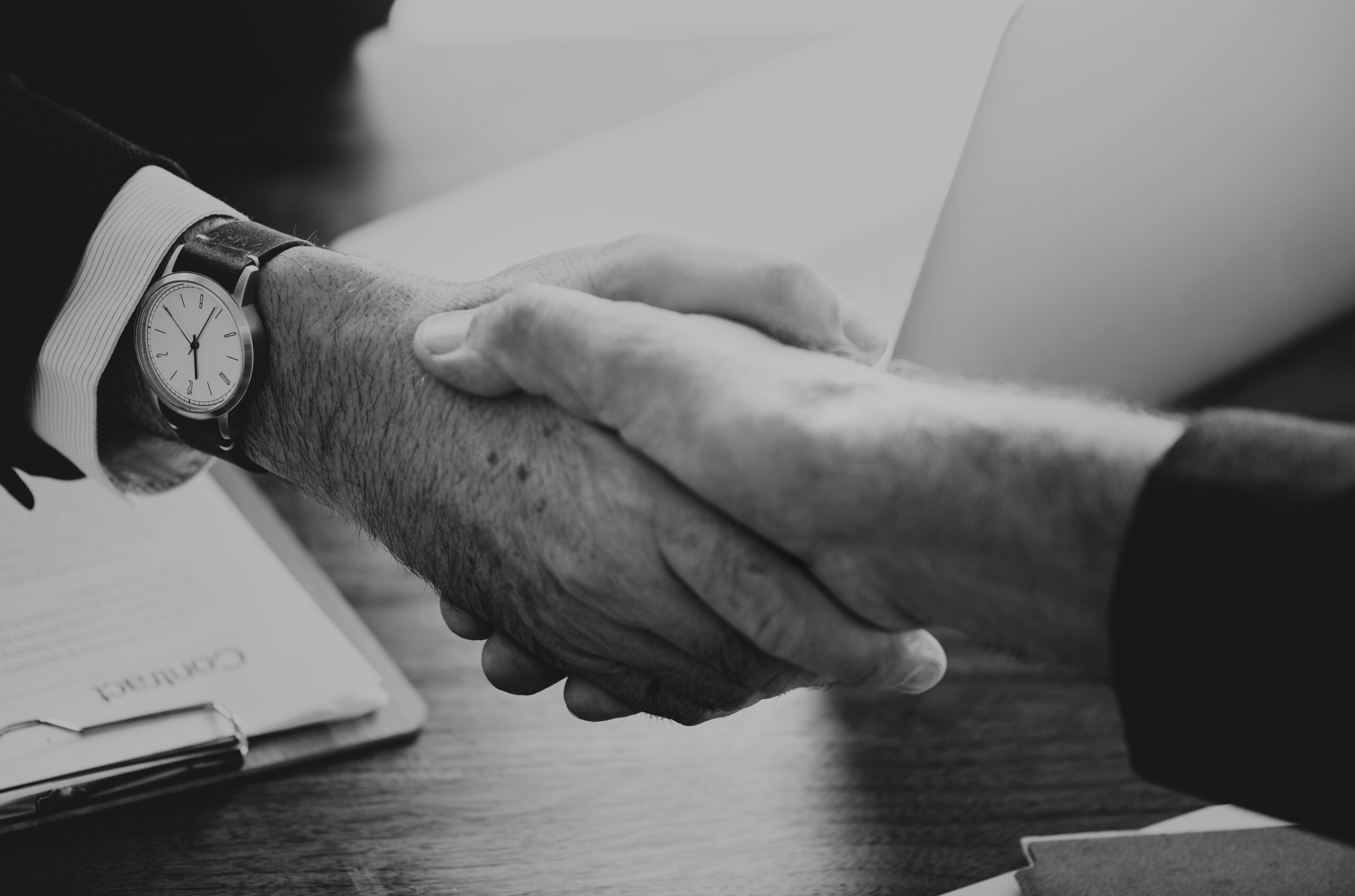 Blog business people shaking hands together
